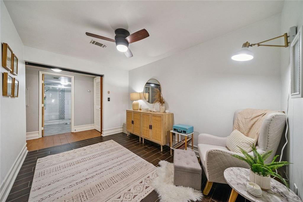 3048 Briarcliff Road Northeast, Unit 9 Atlanta, GA 30329 - Photo 19 of 30 a room with furniture and a wooden floor