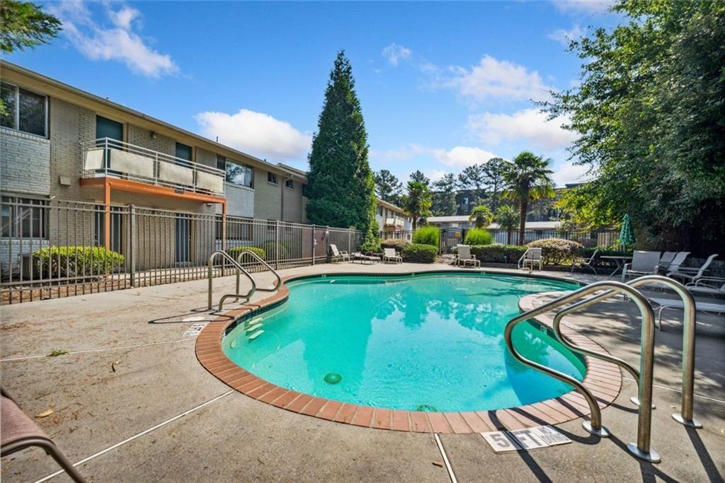 3048 Briarcliff Road Northeast, Unit 9 Atlanta, GA 30329 - Photo 24 of 30 a view of a swimming pool with chairs