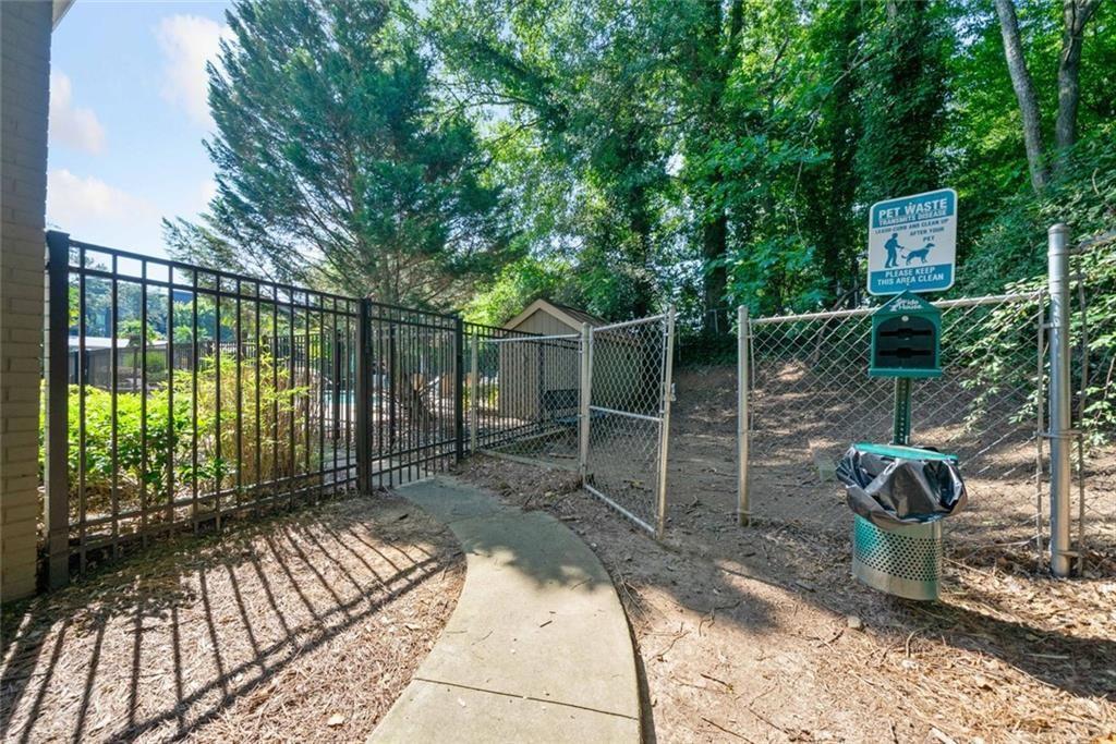 3048 Briarcliff Road Northeast, Unit 9 Atlanta, GA 30329 - Photo 26 of 30 a view of a backyard with a iron fence