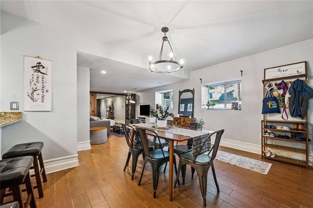 3048 Briarcliff Road Northeast, Unit 9 Atlanta, GA 30329 - Photo 4 of 30 a view of a dining room with furniture and wooden floor