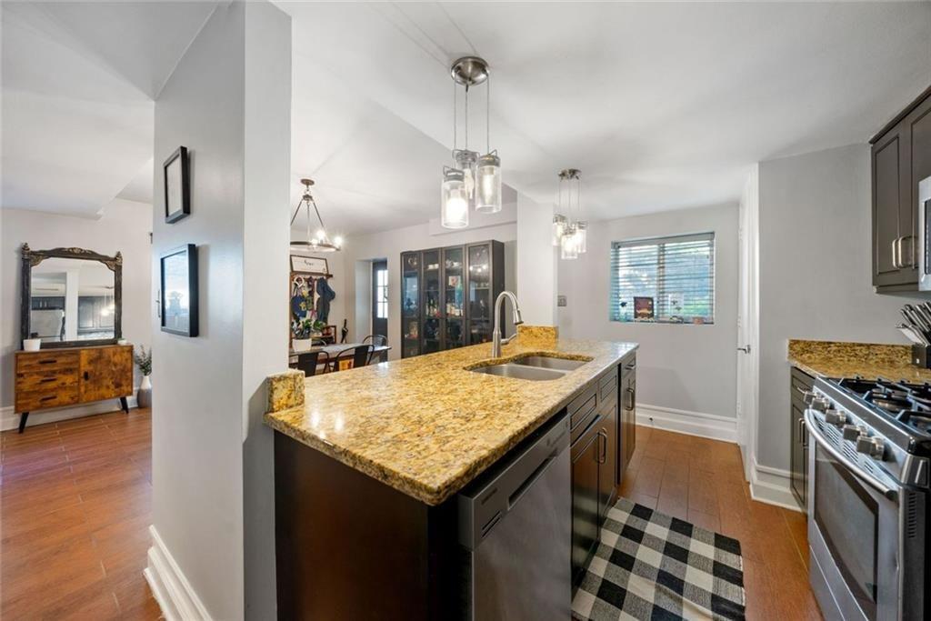 3048 Briarcliff Road Northeast, Unit 9 Atlanta, GA 30329 - Photo 8 of 30 a kitchen with granite countertop a stove and a sink