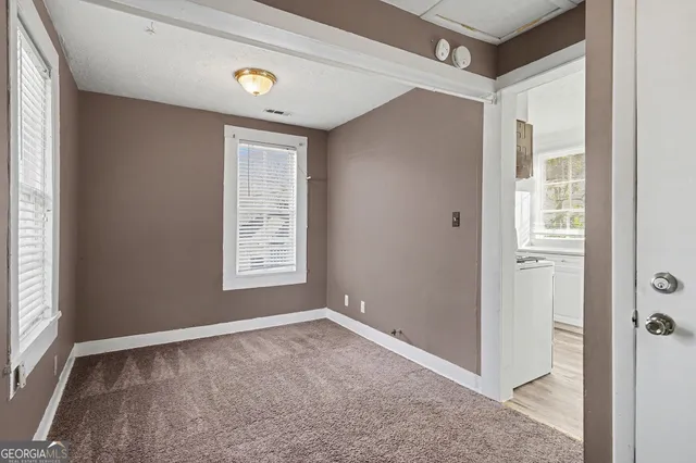 a view of an empty room and window