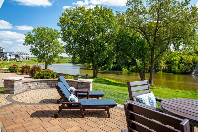 a view of a patio with swimming pool table and chairs