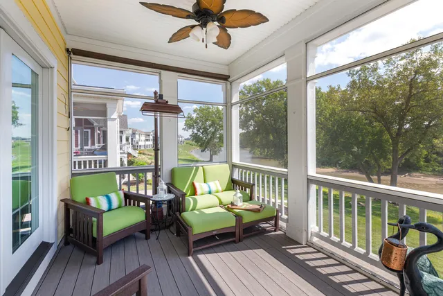 a balcony with furniture and garden view