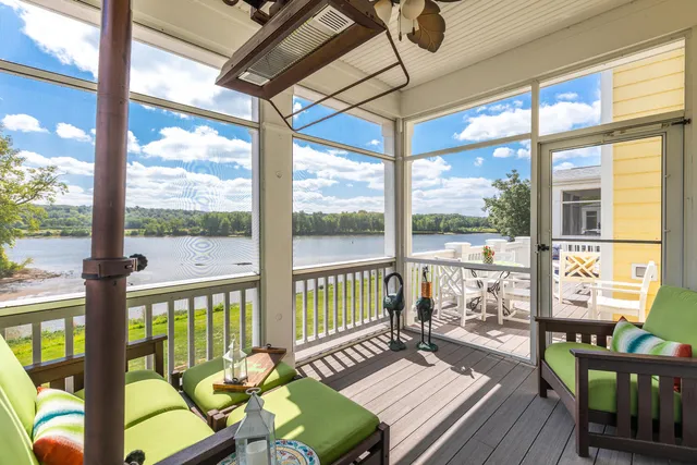 a view of a living room with furniture and wooden floor