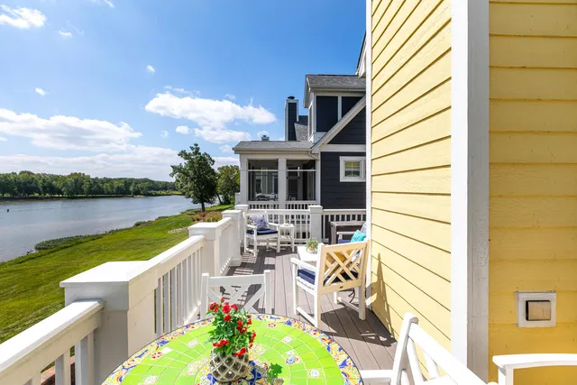 a view of a house with lake and a garden