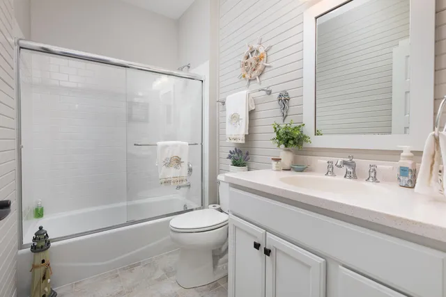 a bathroom with a sink a toilet and a bathtub