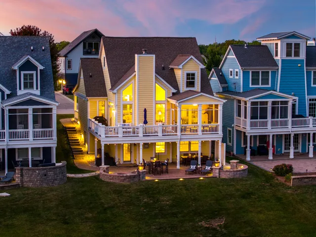 front view of multiple houses with a yard