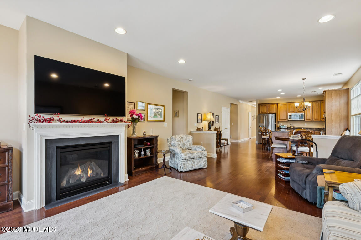 101 Nottingham Way Jackson, NJ 08527 - Photo 12 of 31 a living room with furniture a flat screen tv and a fireplace