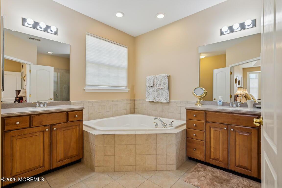 101 Nottingham Way Jackson, NJ 08527 - Photo 15 of 31 a spacious bathroom with a tub sink and mirror