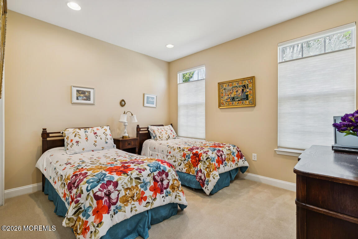 101 Nottingham Way Jackson, NJ 08527 - Photo 17 of 31 a bedroom with two beds and a dresser with wooden floor