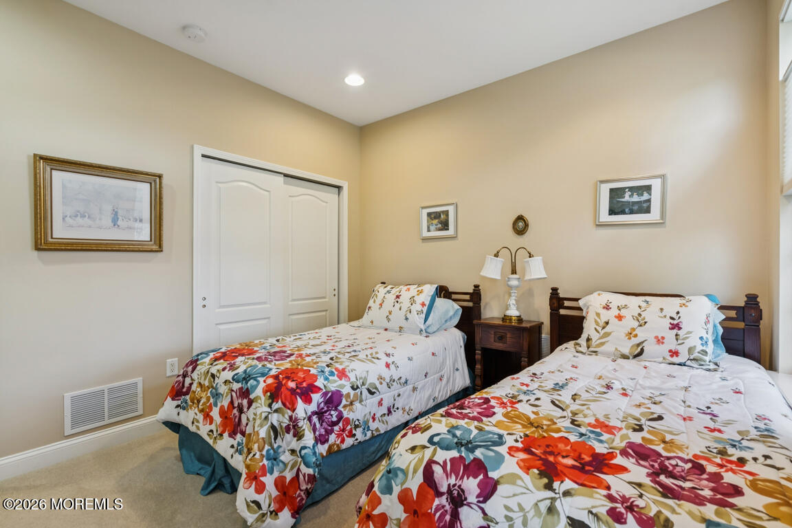 101 Nottingham Way Jackson, NJ 08527 - Photo 18 of 31 a bedroom with two beds and painting on the wall