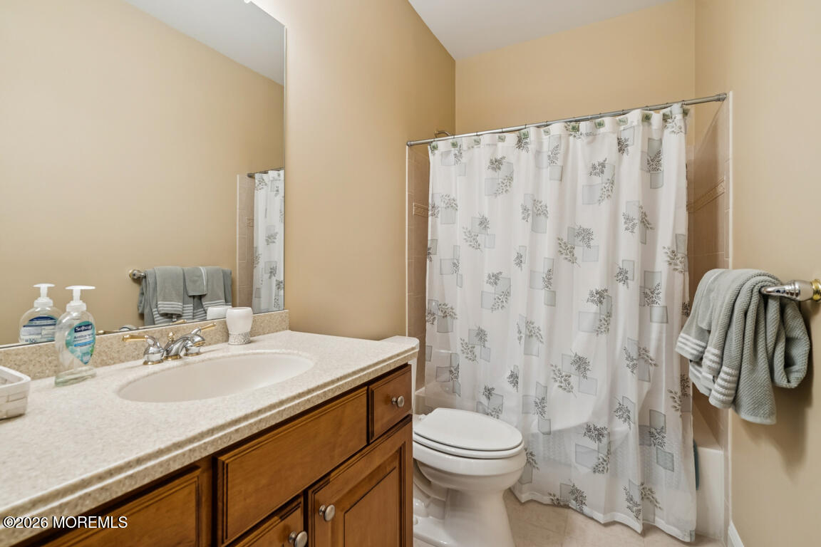 101 Nottingham Way Jackson, NJ 08527 - Photo 21 of 31 a bathroom with a sink a toilet and shower curtain