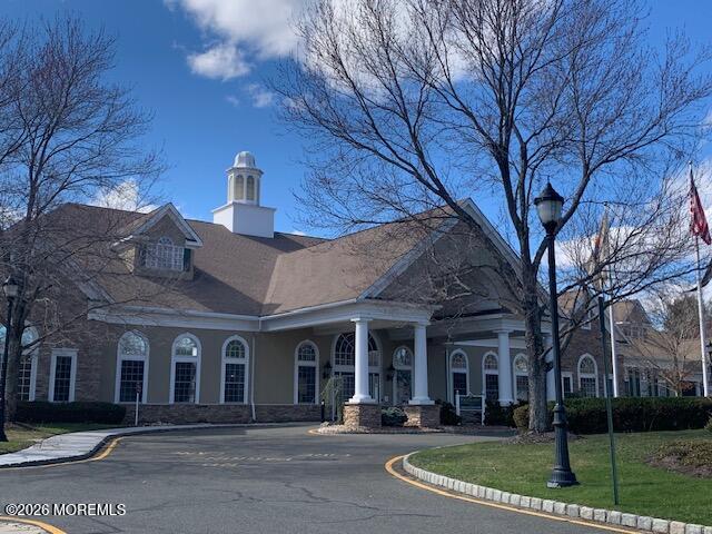 101 Nottingham Way Jackson, NJ 08527 - Photo 26 of 31 front view of a building with a garden