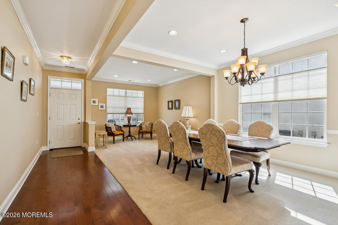 101 Nottingham Way Jackson, NJ 08527 - Photo 4 of 31 a dining room with furniture potted plants and wooden floor