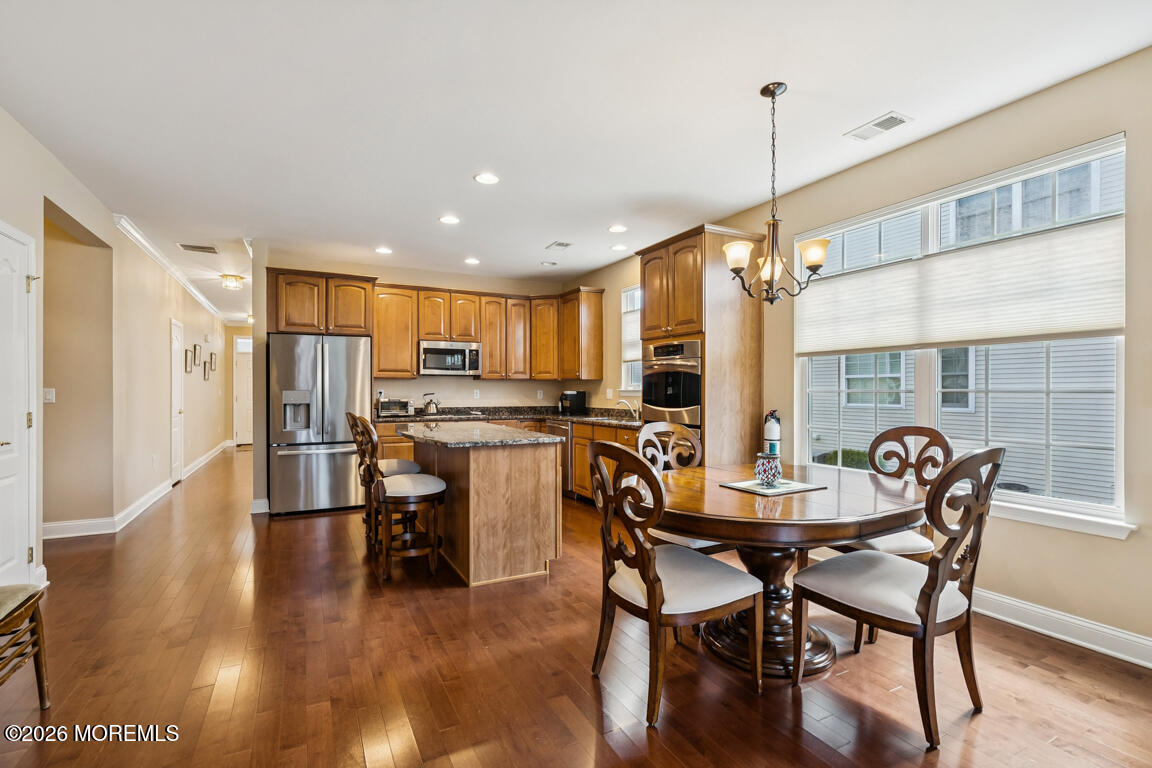 101 Nottingham Way Jackson, NJ 08527 - Photo 6 of 31 a dining room with furniture and wooden floor