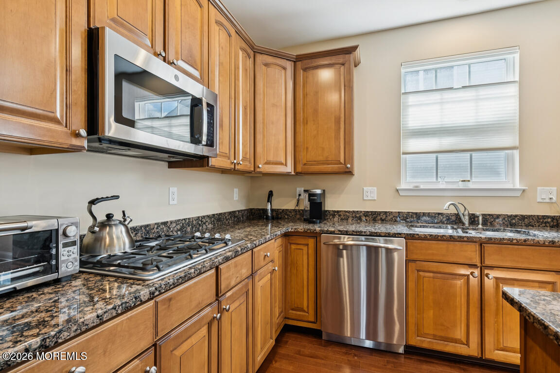 101 Nottingham Way Jackson, NJ 08527 - Photo 9 of 31 a kitchen with granite countertop a stove sink and cabinets