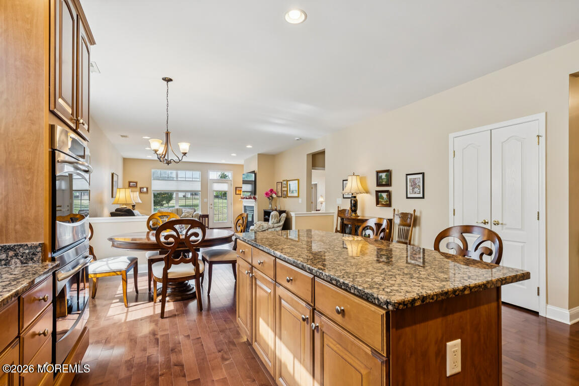 101 Nottingham Way Jackson, NJ 08527 - Photo 10 of 31 a kitchen with granite countertop kitchen island stainless steel appliances a table chairs stove and cabinets