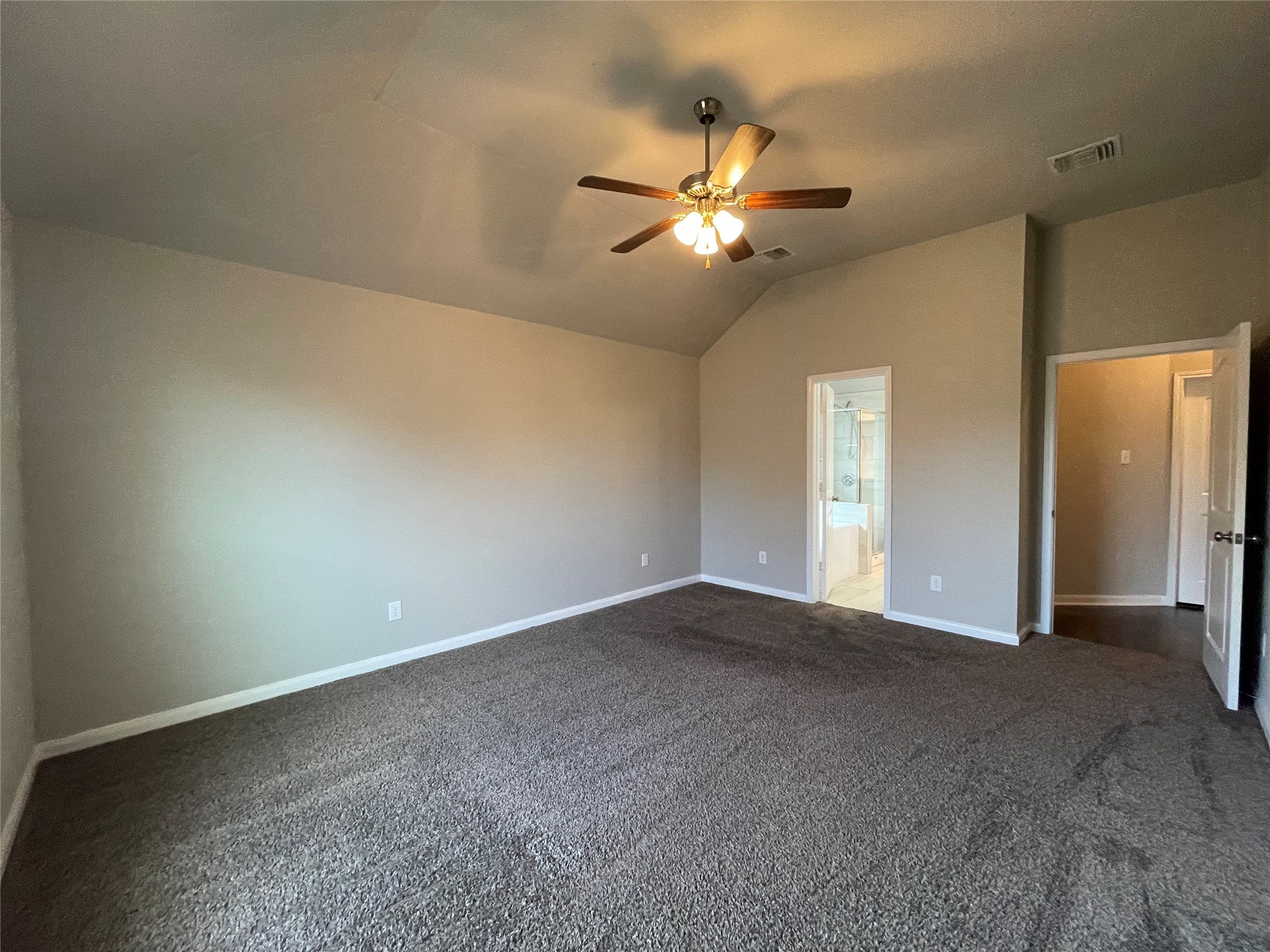 8113 Northgate Loop Temple, TX 76502 - Photo 14 of 35 Spacious room featuring vaulted ceilings, neutral-toned walls, and a ceiling fan with integrated lighting