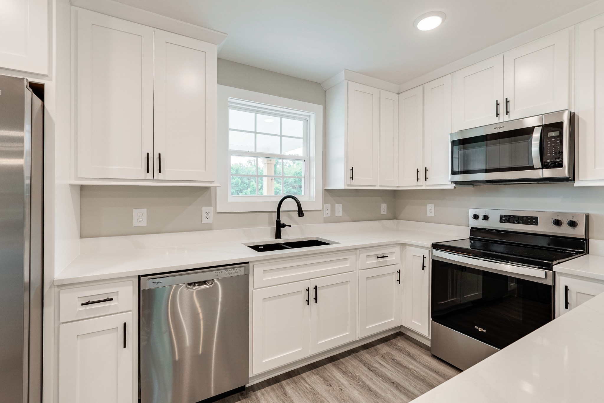 916 Butler Bridge Road Portland, TN 37148 - Photo 11 of 26 a kitchen with appliances a sink and cabinets