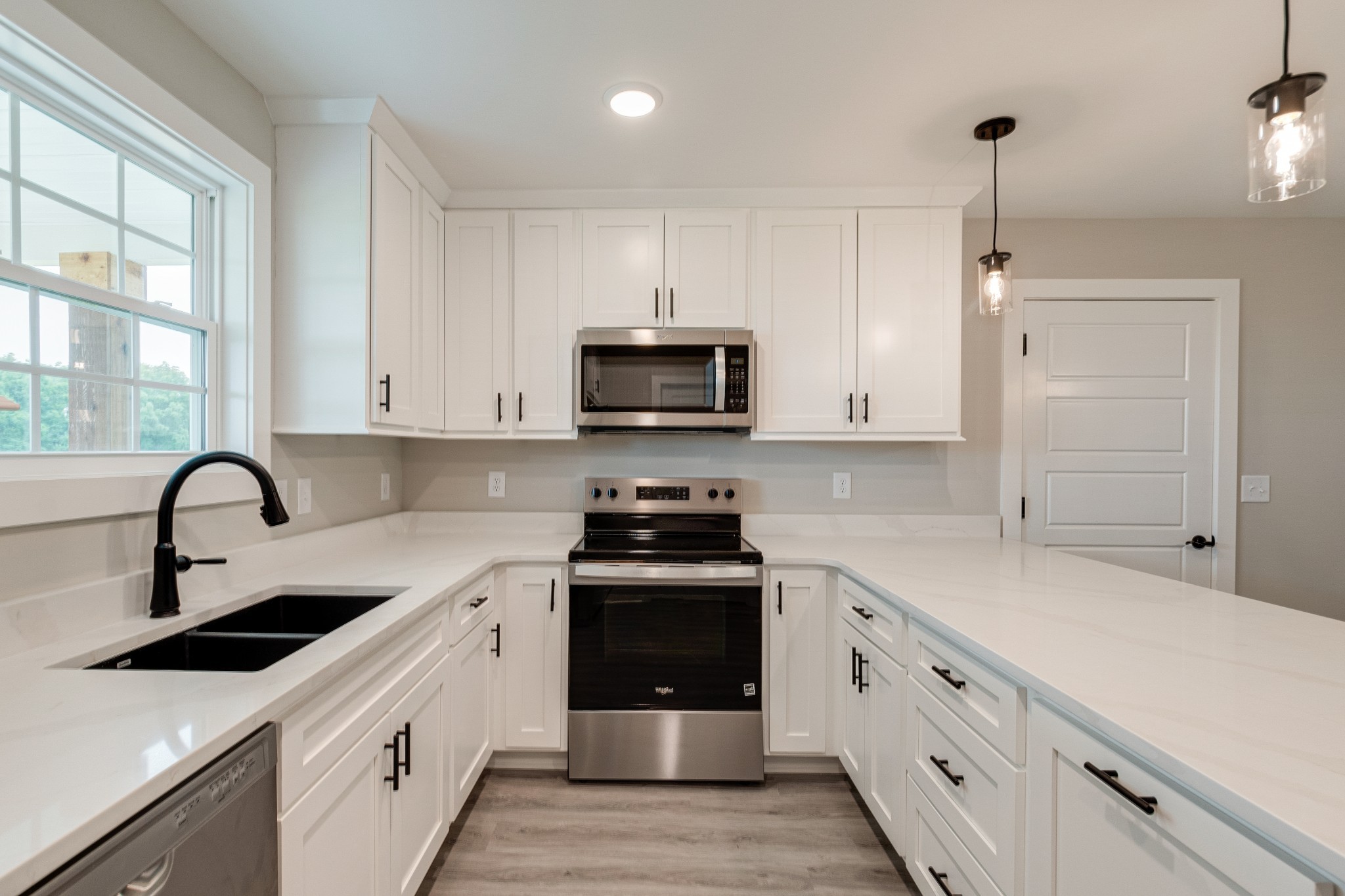 916 Butler Bridge Road Portland, TN 37148 - Photo 12 of 26 a kitchen with granite countertop a stove and a sink