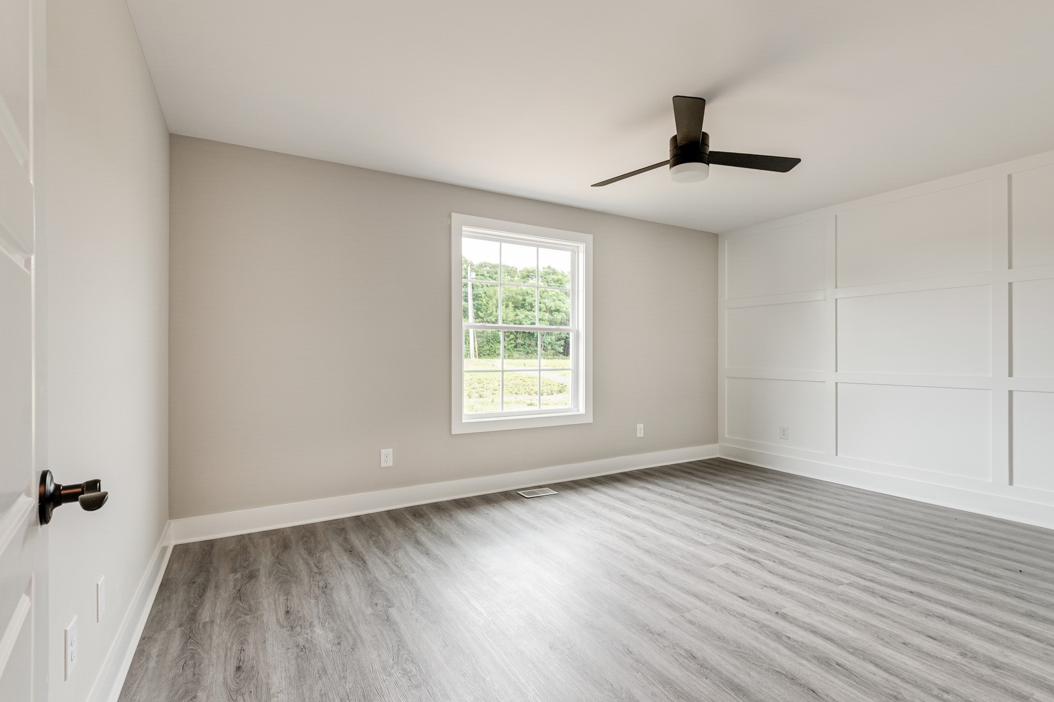 916 Butler Bridge Road Portland, TN 37148 - Photo 17 of 26 a view of an empty room with wooden floor and a window