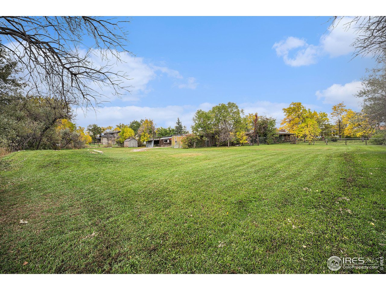 6137 Baseline Road Boulder, CO 80303 - Photo 18 of 40 a backyard of a house with lots of green space