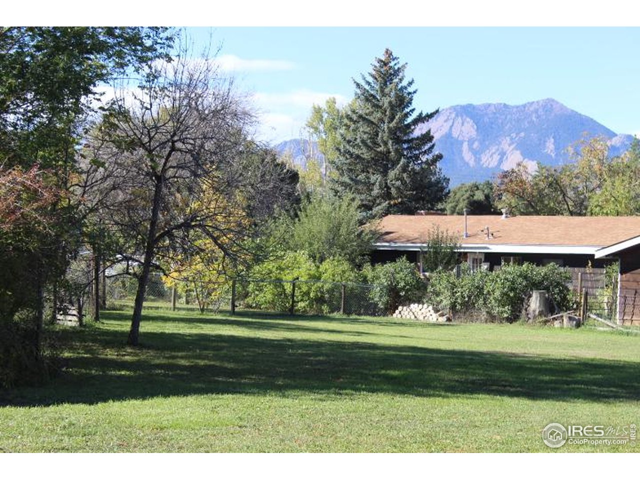 6137 Baseline Road Boulder, CO 80303 - Photo 25 of 40 a view of a house with a yard