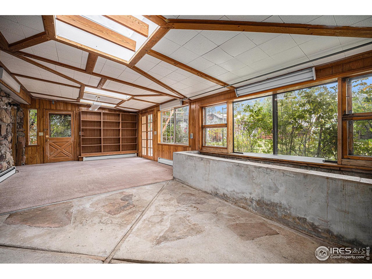 6137 Baseline Road Boulder, CO 80303 - Photo 4 of 40 a view of an empty room with a balcony