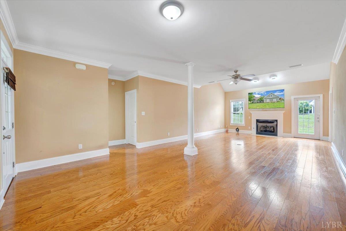 1250 Our Cove Road Huddleston, VA 24104 - Photo 9 of 70 an empty room with wooden floor and windows