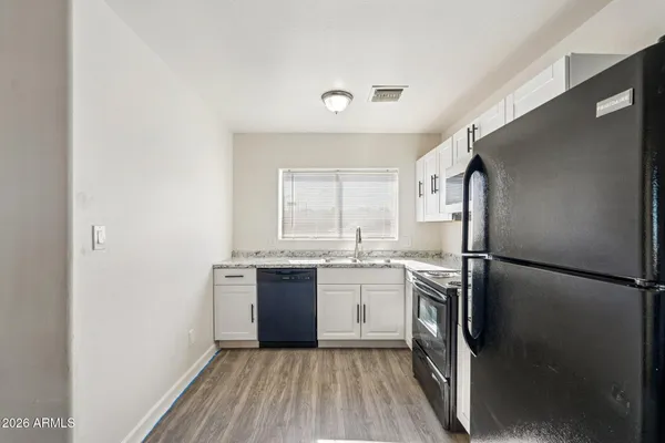 a kitchen with a refrigerator a sink and dishwasher