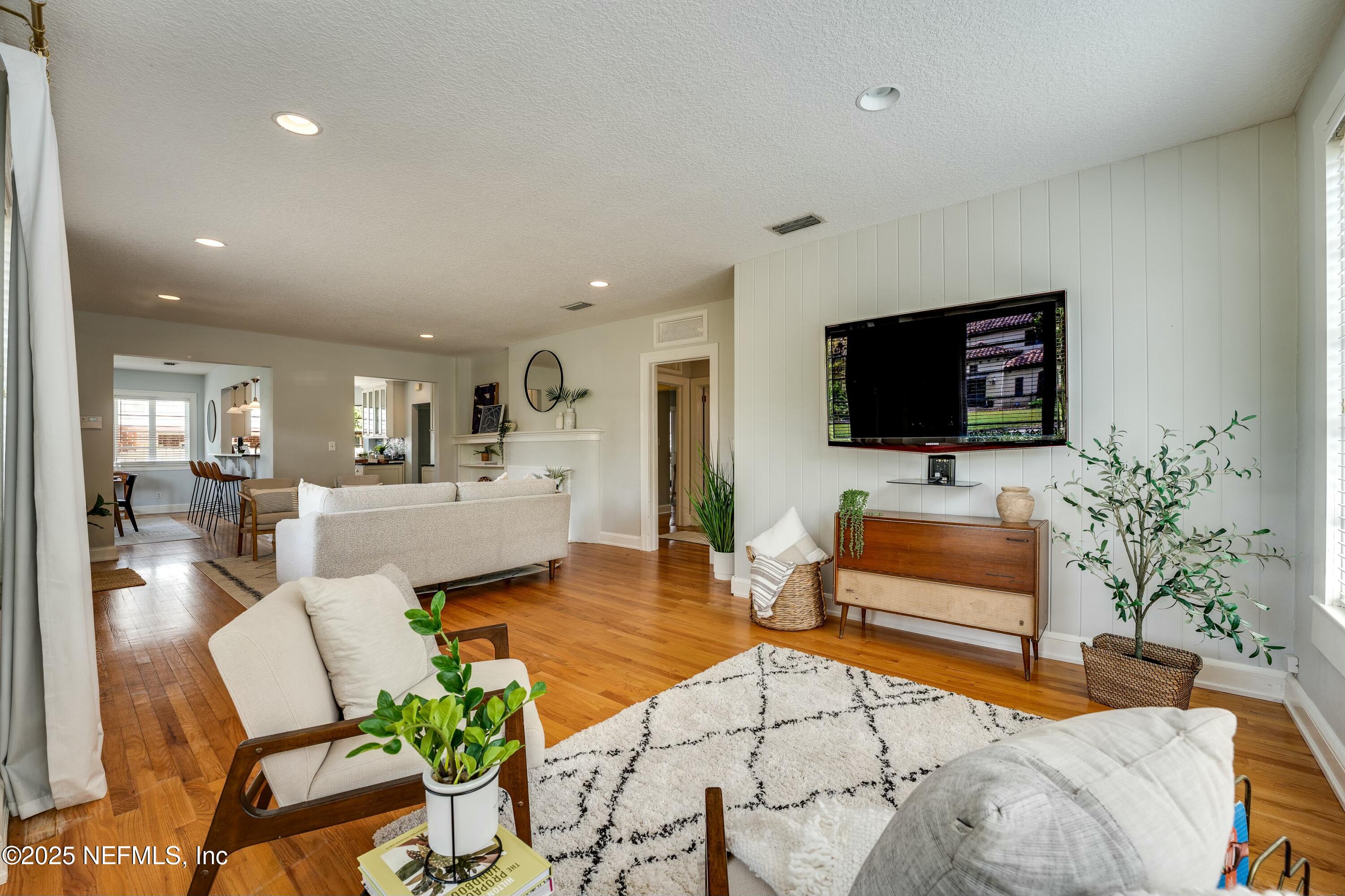 1235 Morvenwood Road Jacksonville, FL 32207 - Photo 13 of 55 a living room with furniture and a flat screen tv