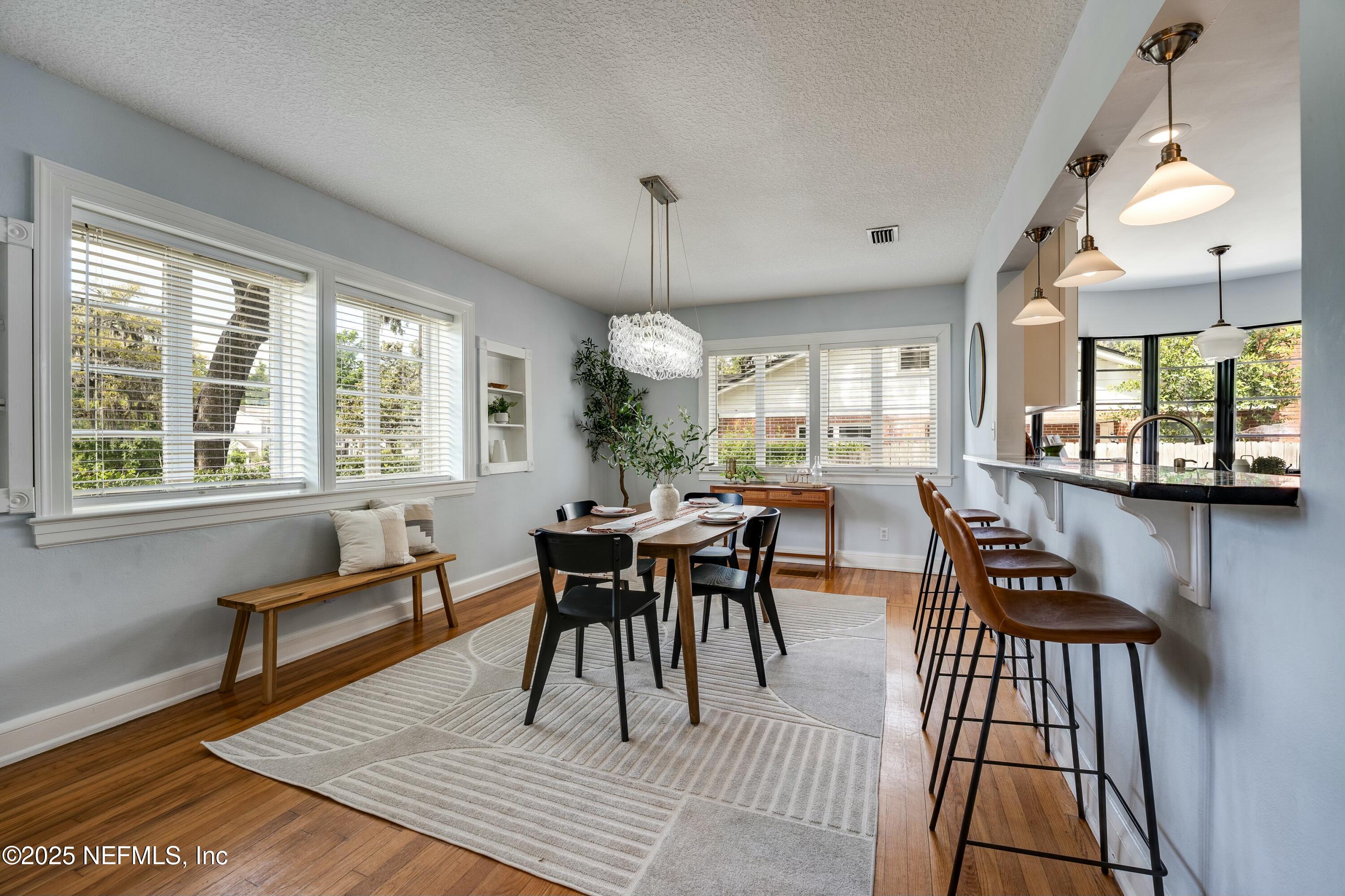 1235 Morvenwood Road Jacksonville, FL 32207 - Photo 14 of 55 a view of a dining room with furniture window and wooden floor