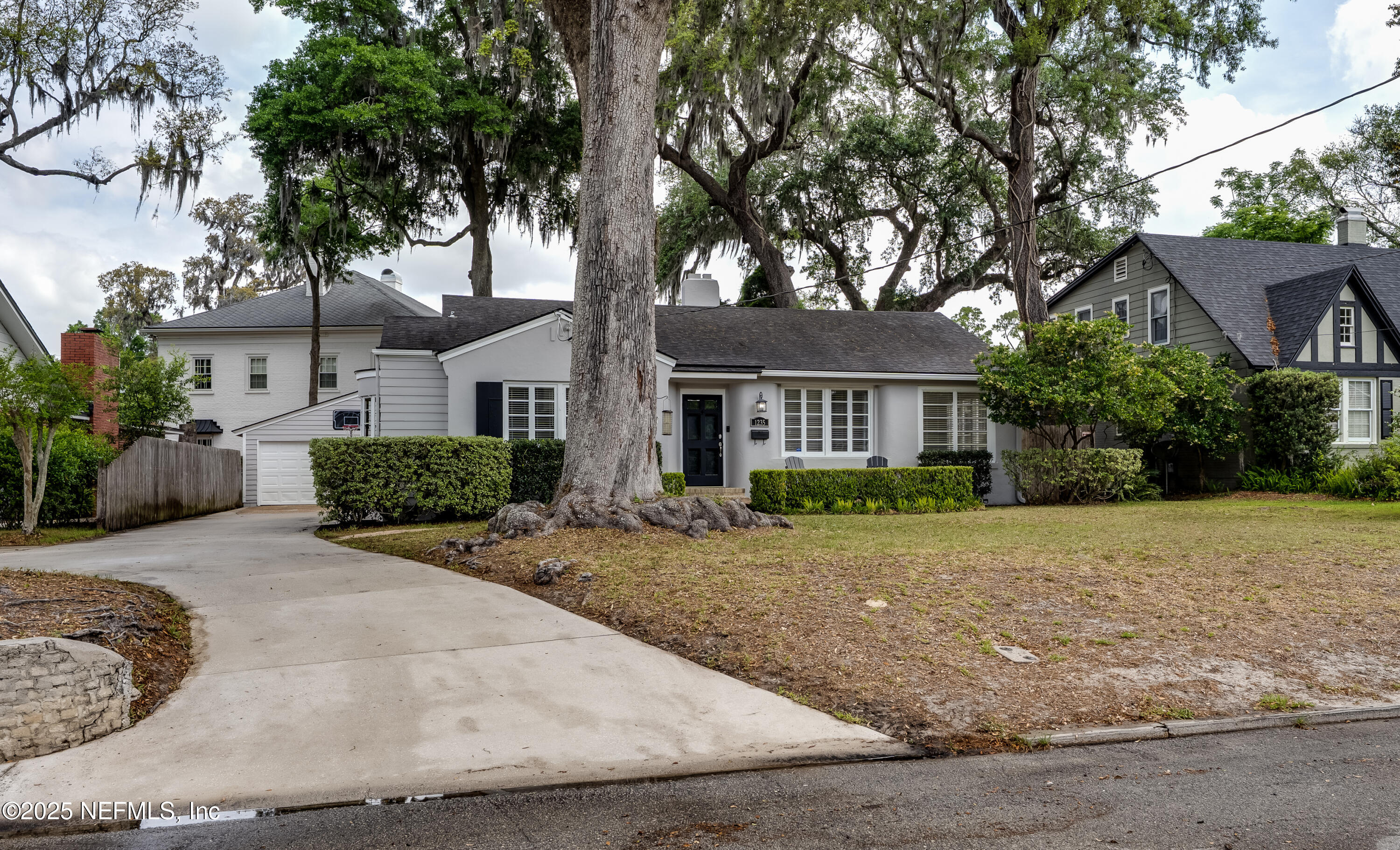 1235 Morvenwood Road Jacksonville, FL 32207 - Photo 2 of 55 a view of a house with a tree in front of it