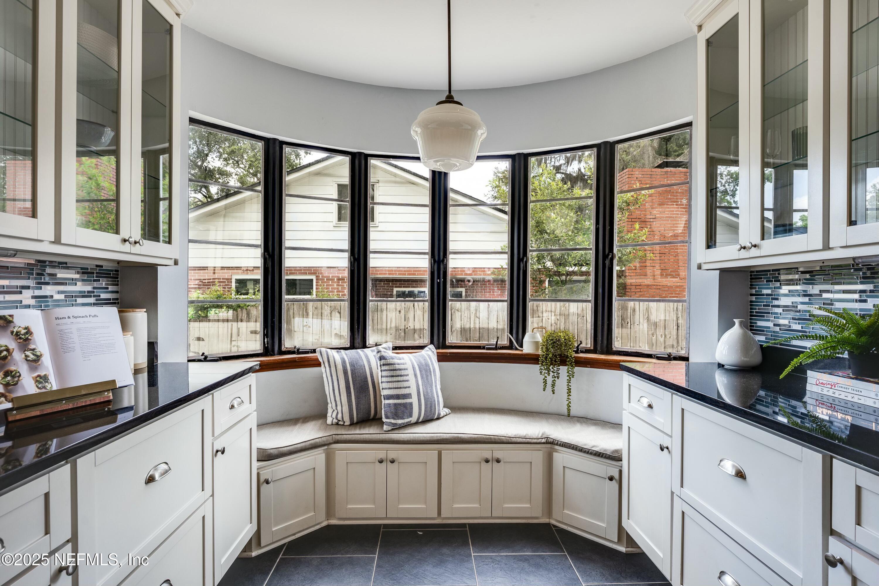 1235 Morvenwood Road Jacksonville, FL 32207 - Photo 23 of 55 a large white kitchen with a large window