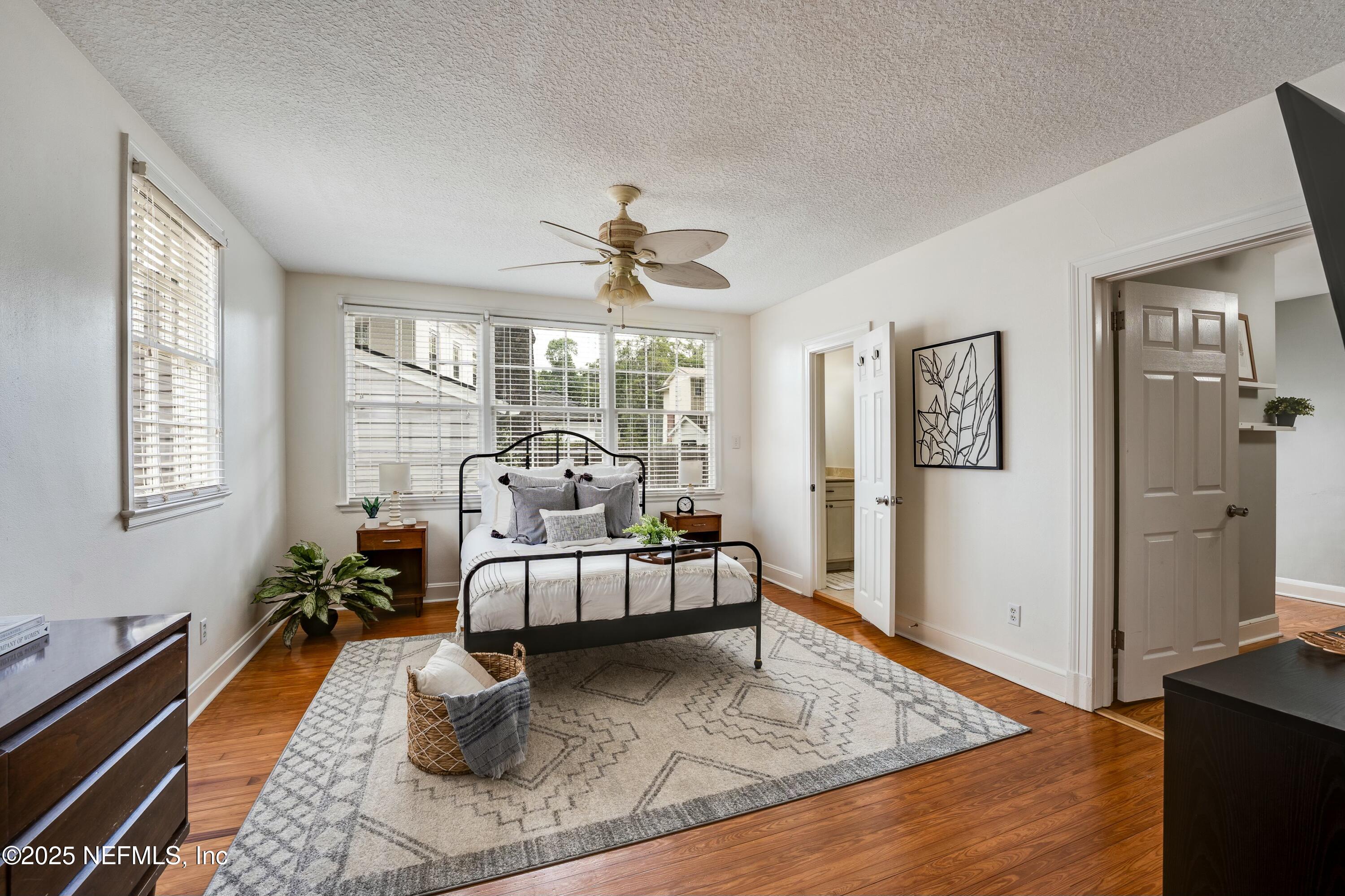 1235 Morvenwood Road Jacksonville, FL 32207 - Photo 24 of 55 a living room with furniture windows and a wooden floor
