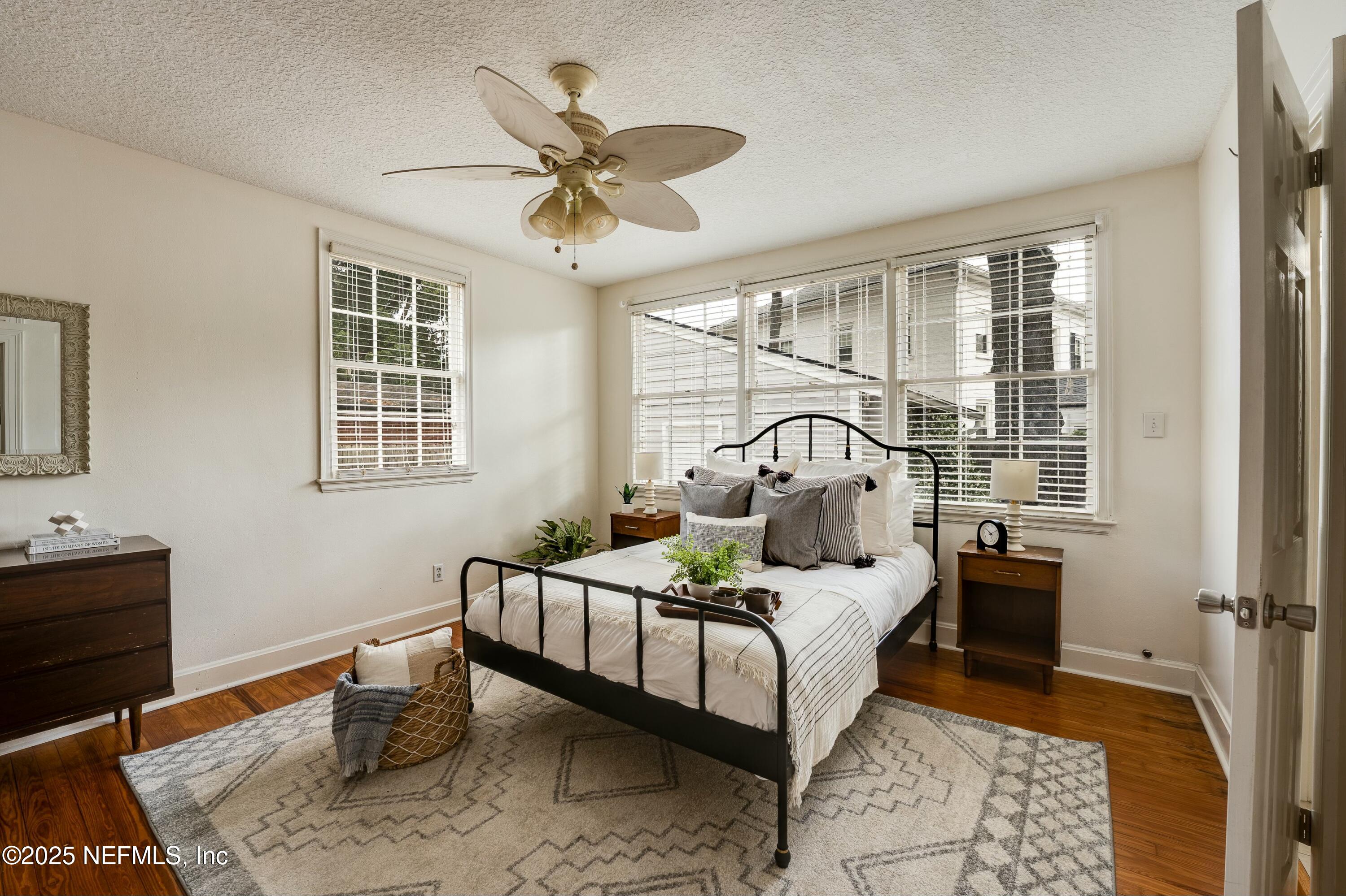 1235 Morvenwood Road Jacksonville, FL 32207 - Photo 25 of 55 a bedroom with a bed and wooden floor