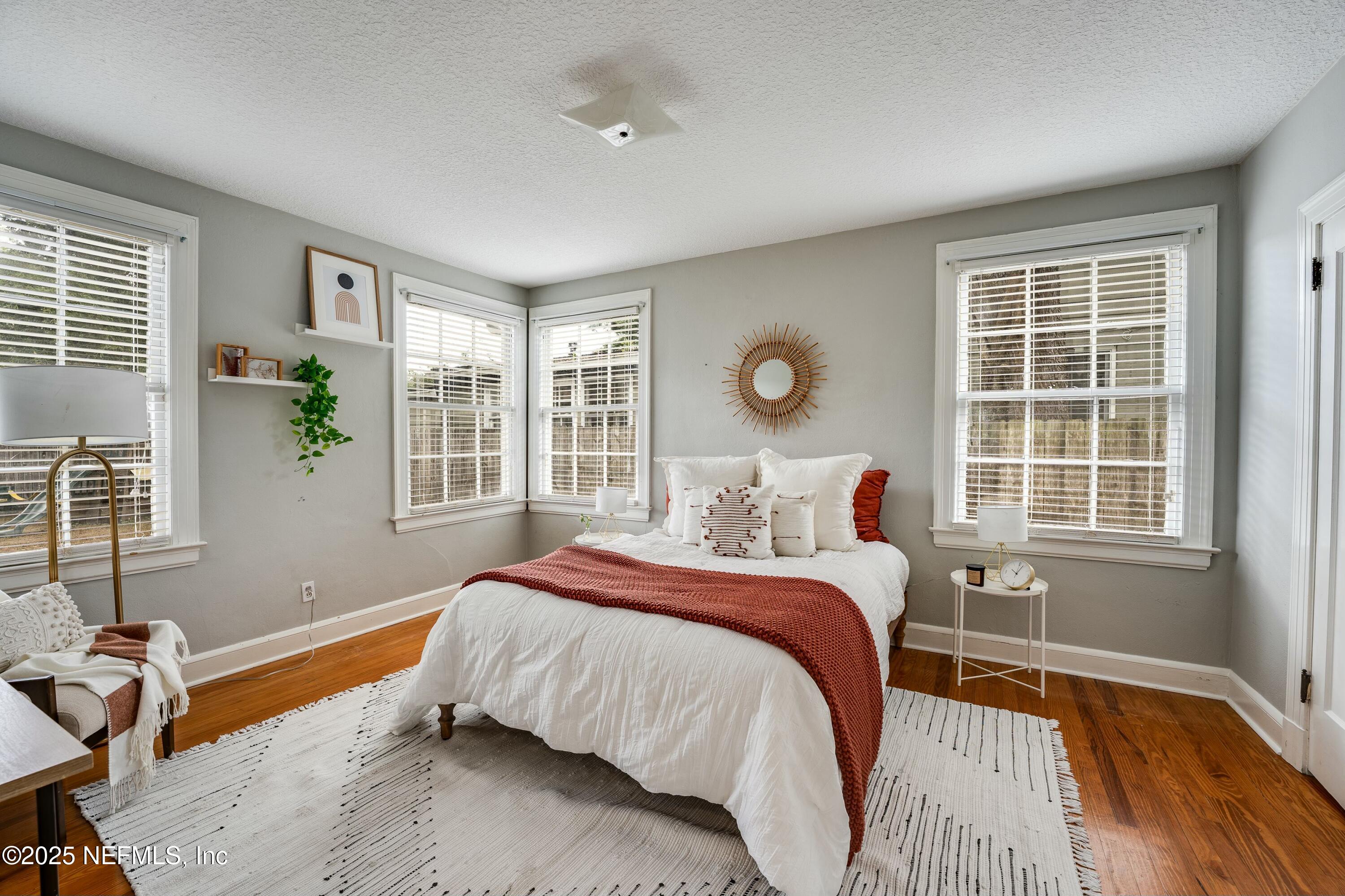 1235 Morvenwood Road Jacksonville, FL 32207 - Photo 30 of 55 a bedroom with a bed and a window