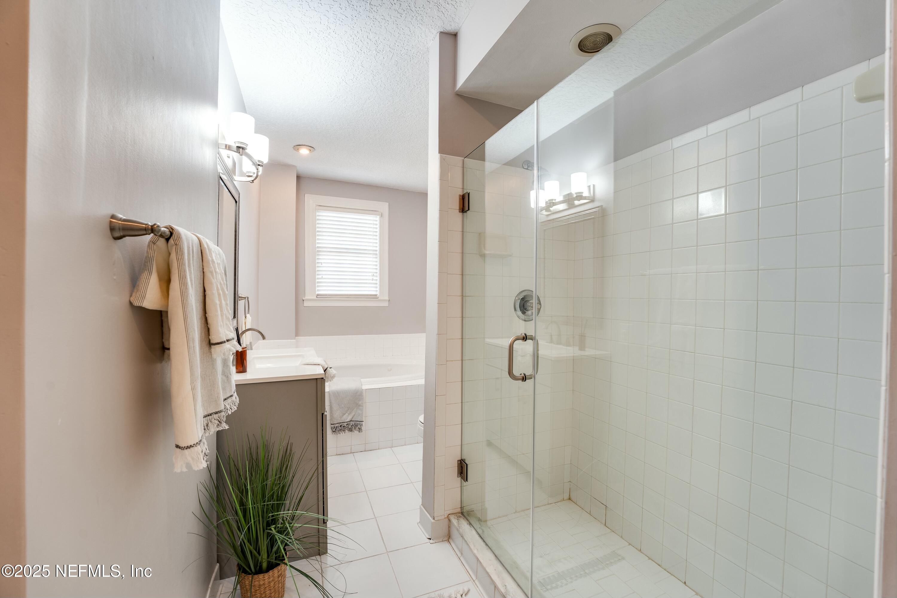 1235 Morvenwood Road Jacksonville, FL 32207 - Photo 33 of 55 a bathroom with a shower and a mirror