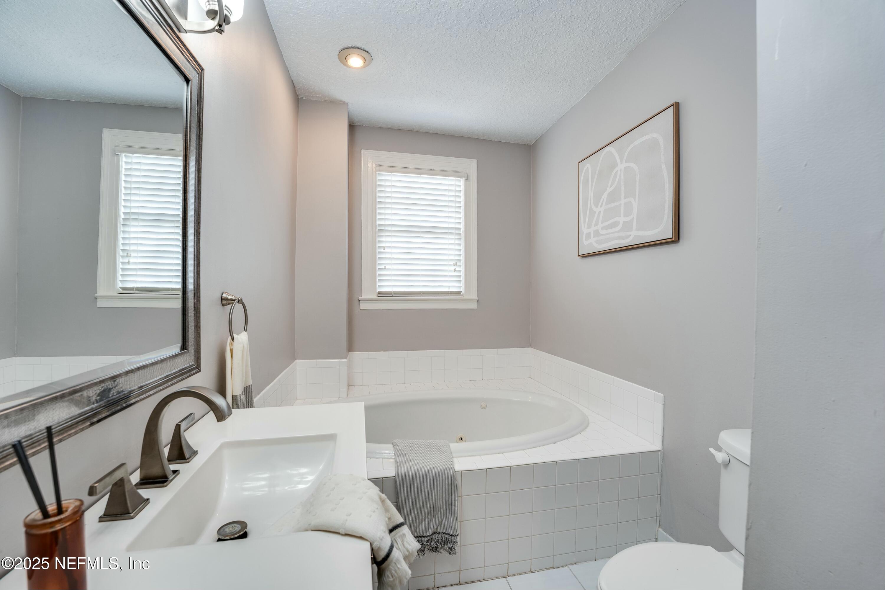 1235 Morvenwood Road Jacksonville, FL 32207 - Photo 34 of 55 a bathroom with a sink and a bathtub