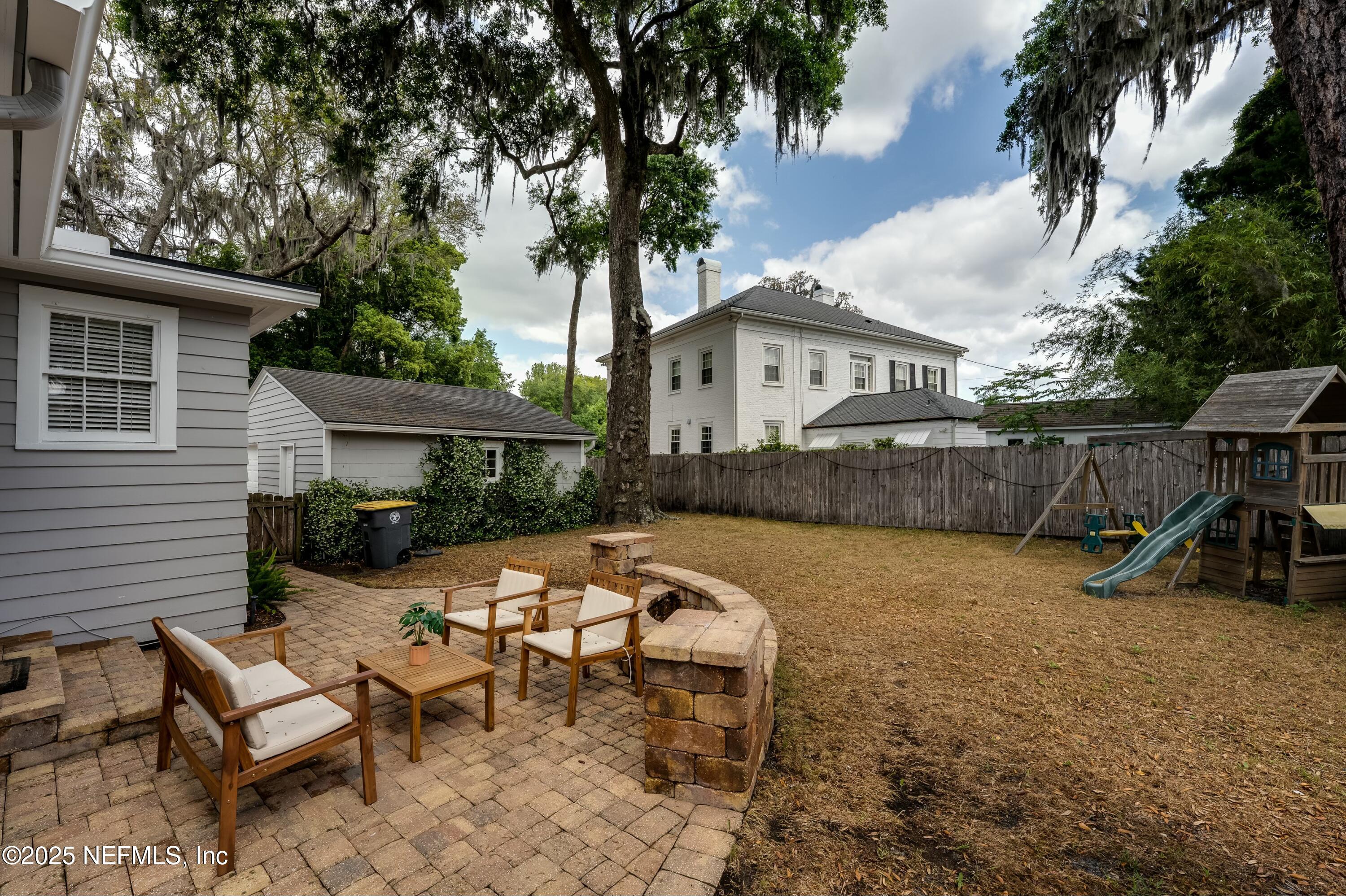 1235 Morvenwood Road Jacksonville, FL 32207 - Photo 39 of 55 a view of a house with backyard and sitting area