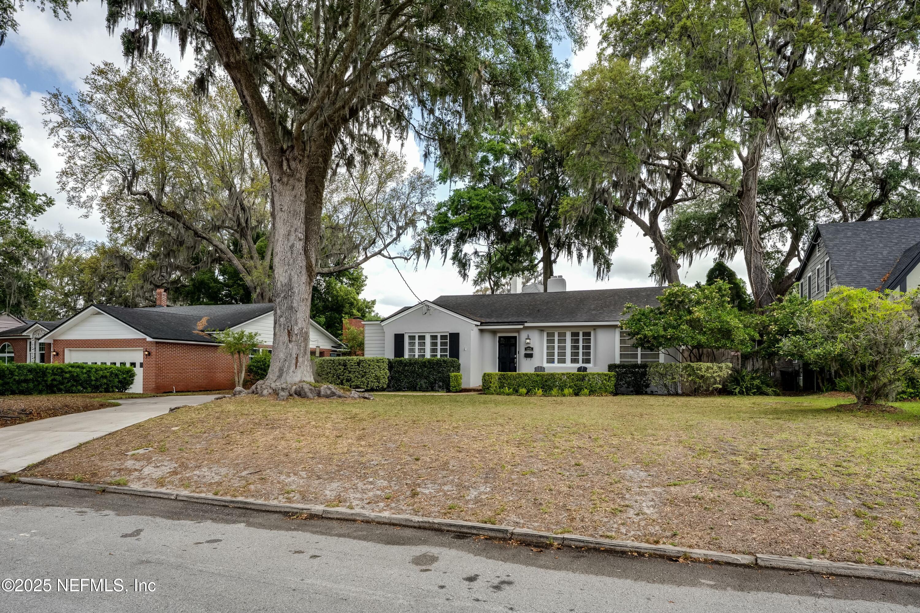 1235 Morvenwood Road Jacksonville, FL 32207 - Photo 4 of 55 a front view of a house with a yard