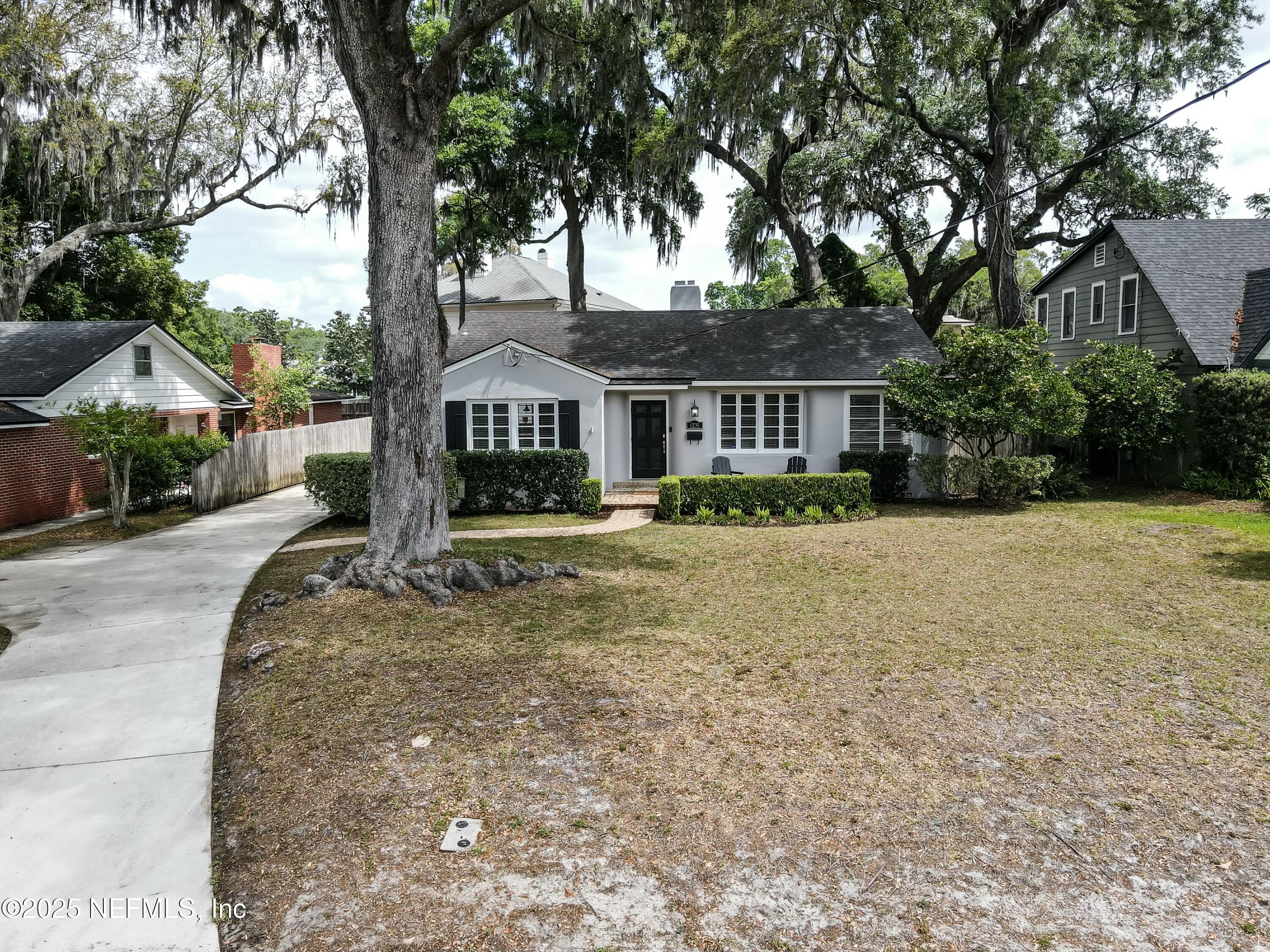1235 Morvenwood Road Jacksonville, FL 32207 - Photo 42 of 55 a front view of a house with a garden