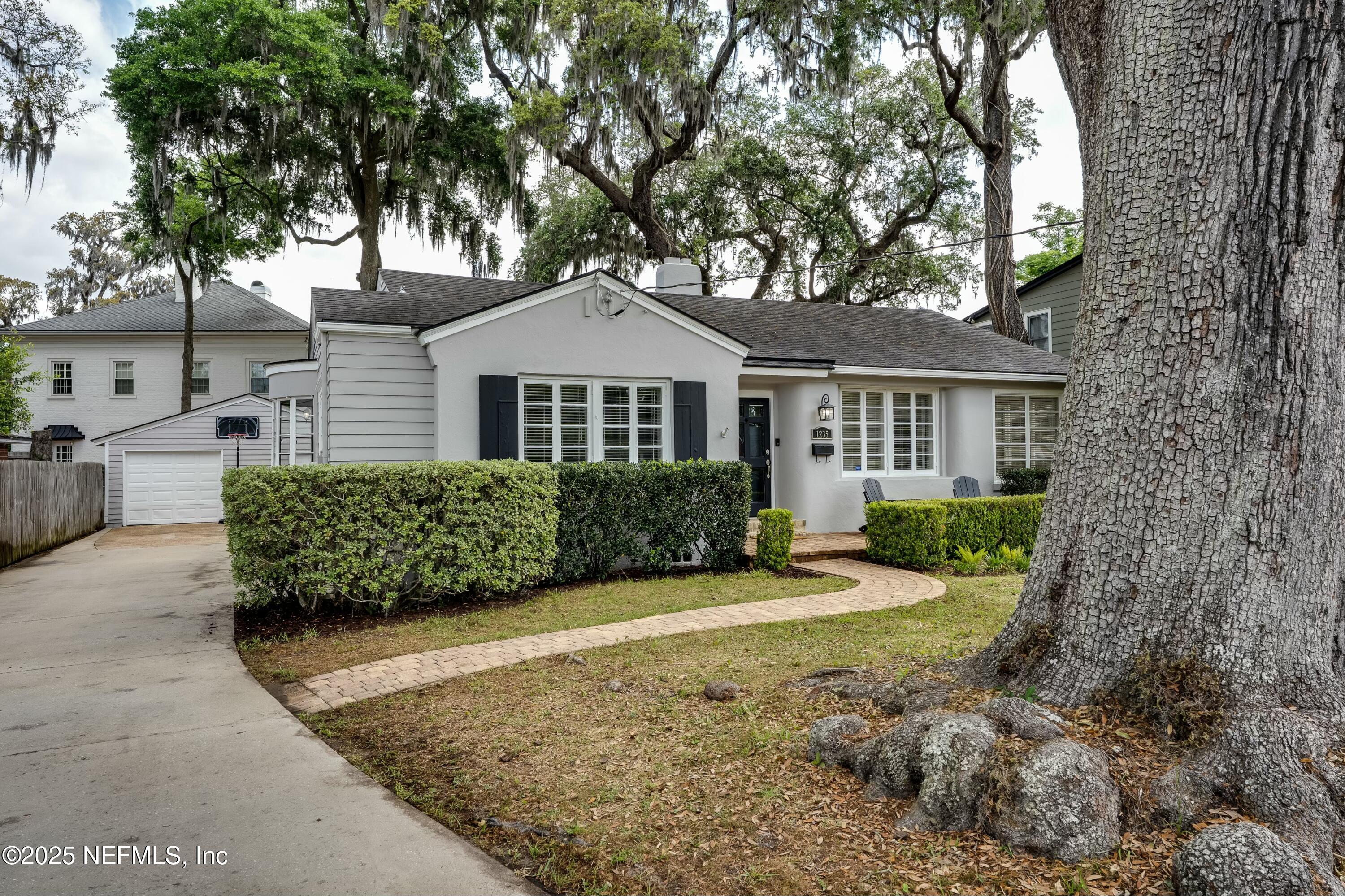 1235 Morvenwood Road Jacksonville, FL 32207 - Photo 5 of 55 a front view of a house with a yard