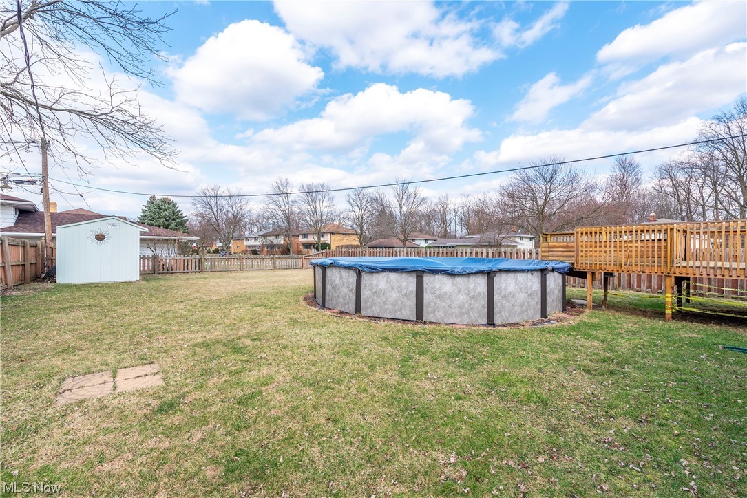 7094 Brandywine Road Parma Heights, OH 44130 - Photo 7 of 49 View of yard with a covered pool and a shed