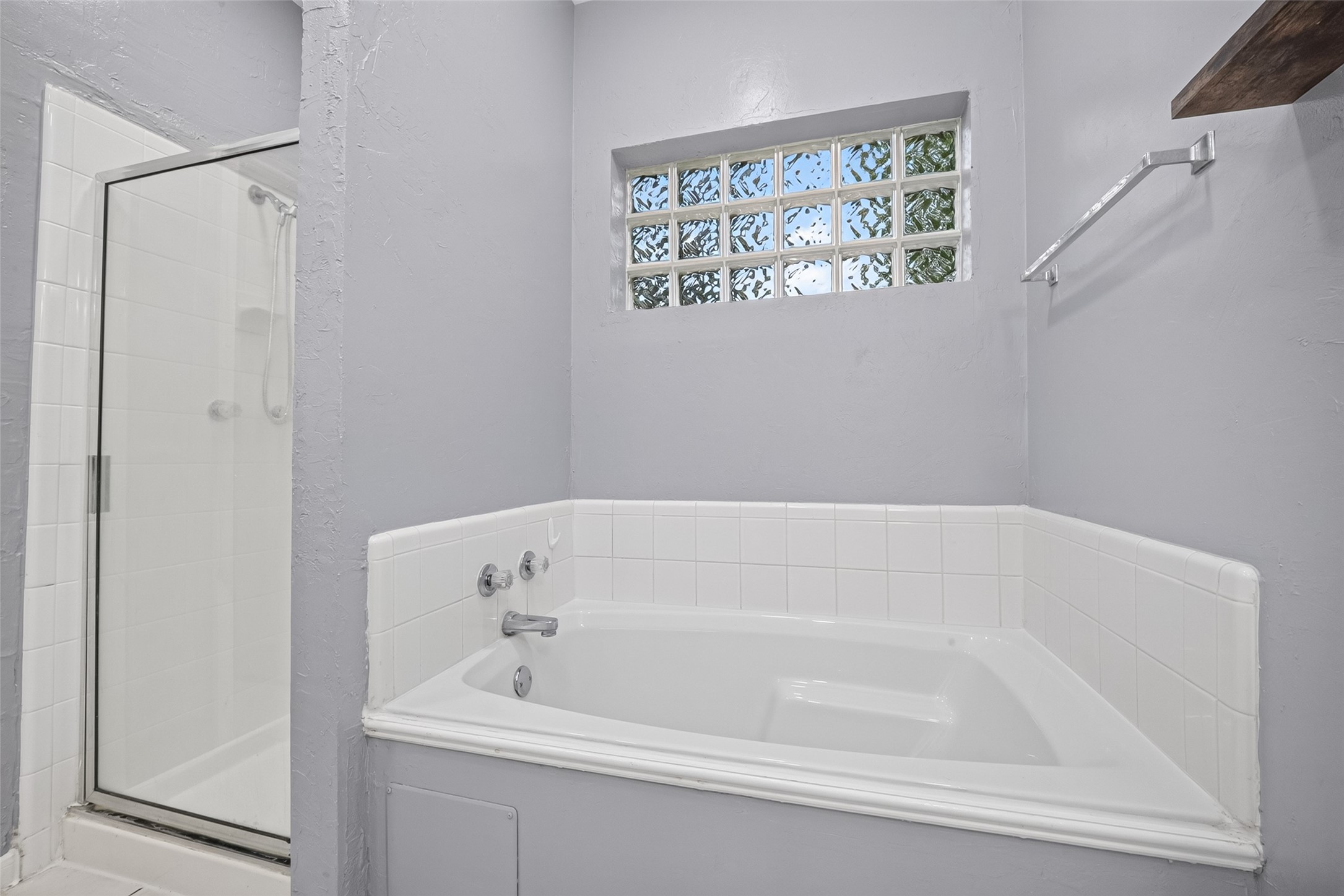 13607 Sable Lane Houston, TX 77014 - Photo 28 of 46 a white bath tub sitting next to a white cabinet