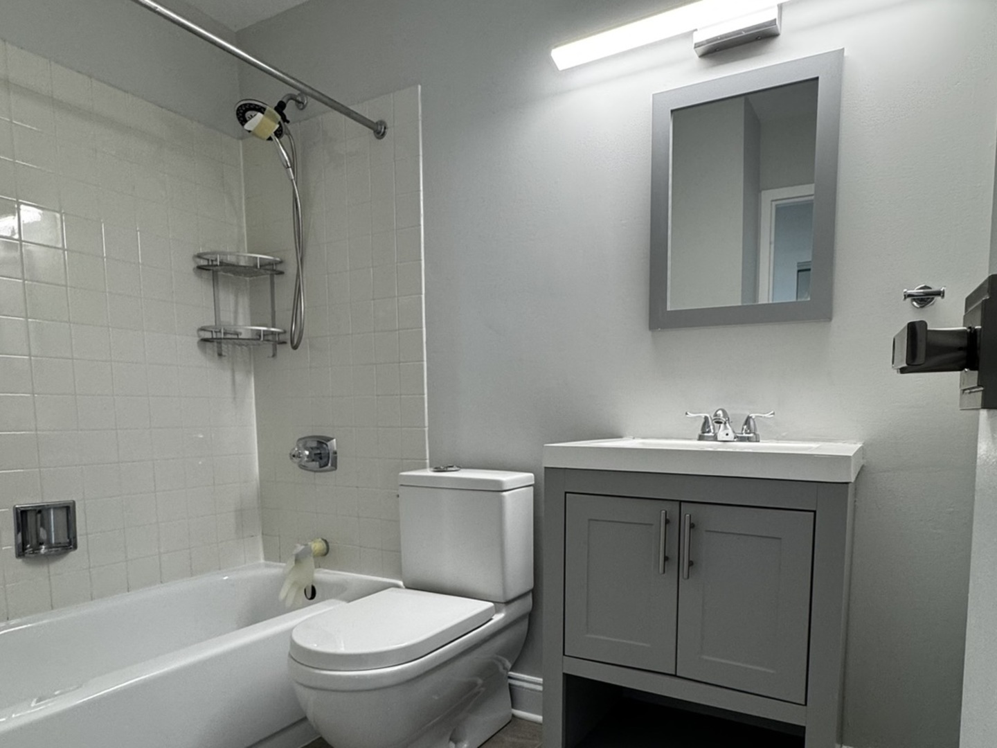 5320 North Sheridan Road, Unit 2109 Chicago, IL 60640 - Photo 9 of 16 a bathroom with a sink toilet and shower