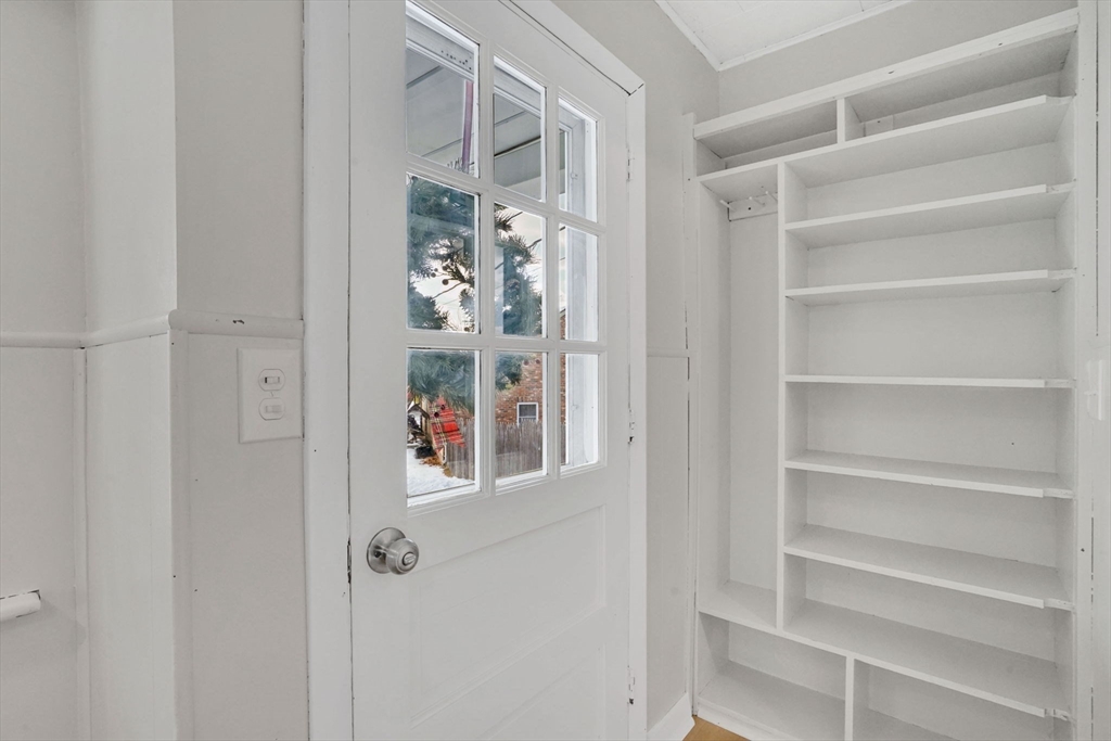 12 Stebbins Street Chicopee, MA 01020 - Photo 13 of 39 a room that has a lot of glasses on the wall