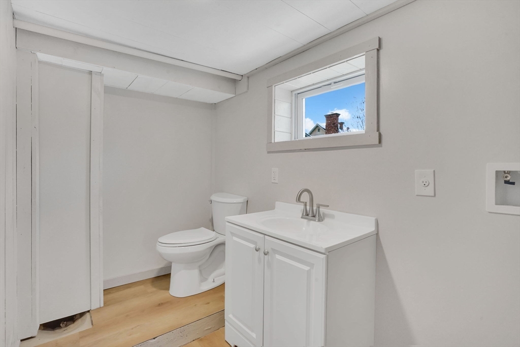 12 Stebbins Street Chicopee, MA 01020 - Photo 18 of 39 a white toilet sitting next to a bathroom sink