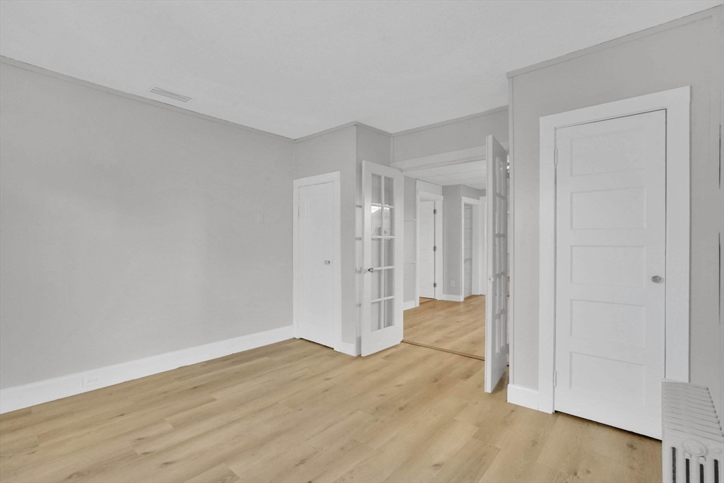 12 Stebbins Street Chicopee, MA 01020 - Photo 21 of 39 a view of empty room with wooden floor